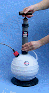 PELA 6000 oil extractor — a manual vacuum pump with a see-through calibrated container.