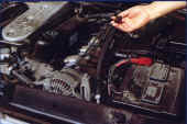 Removing the dipstick from a car engine